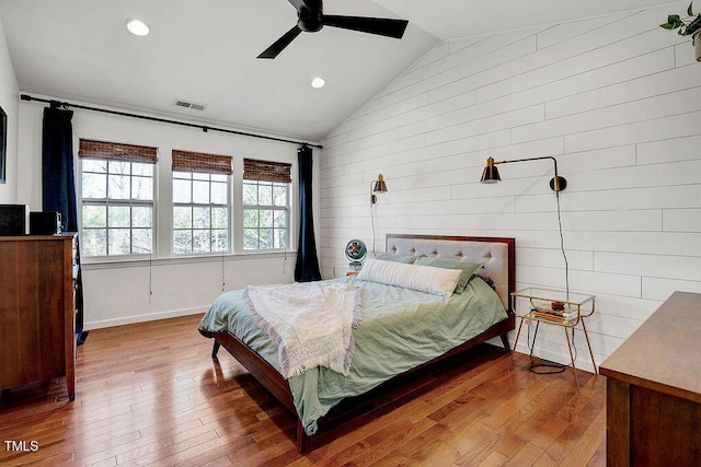 bedroom featuring visible vents, a ceiling fan, hardwood / wood-style floors, recessed lighting, and vaulted ceiling