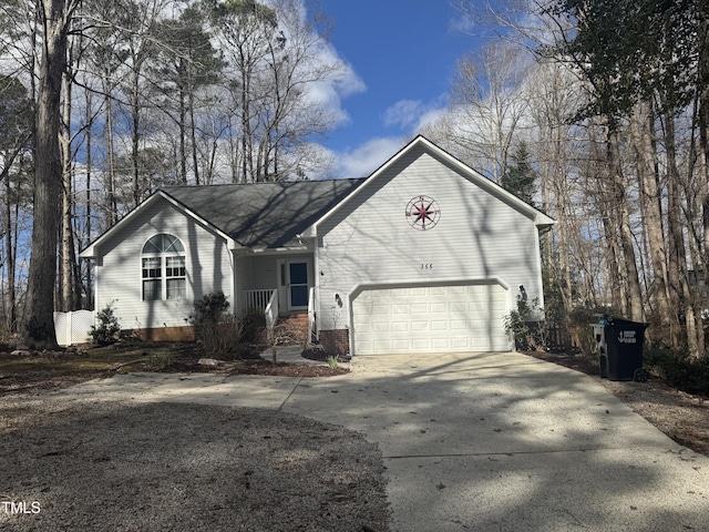 view of front of house featuring brick siding, driveway, and an attached garage