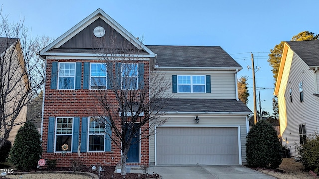 traditional home with concrete driveway, brick siding, and an attached garage