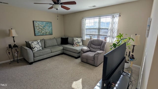 carpeted living room with visible vents, ceiling fan, and baseboards