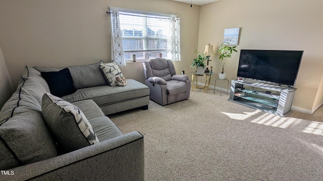 carpeted living room featuring baseboards