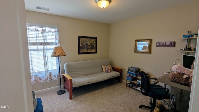 carpeted home office with visible vents and baseboards