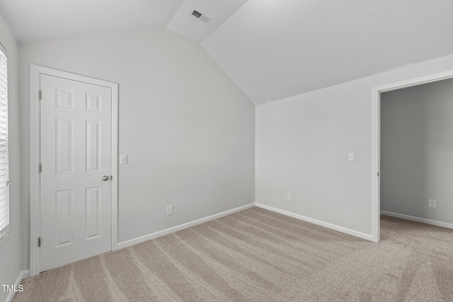 bonus room featuring carpet floors, lofted ceiling, visible vents, and baseboards