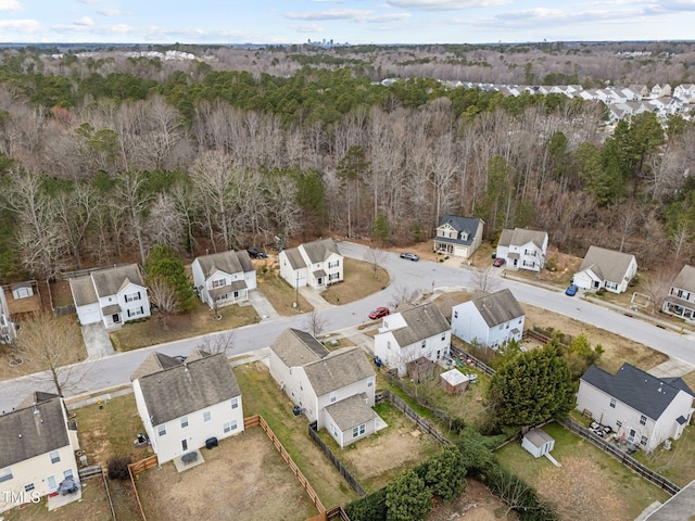 bird's eye view with a forest view and a residential view