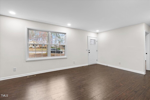 interior space with recessed lighting, visible vents, dark wood finished floors, and baseboards