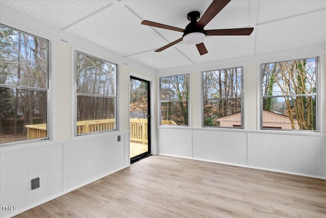 unfurnished sunroom with a ceiling fan