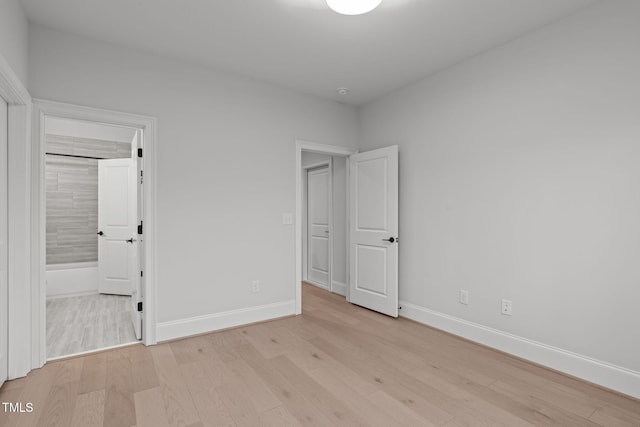 unfurnished bedroom with baseboards and light wood finished floors