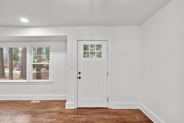 entryway featuring visible vents, baseboards, wood finished floors, and recessed lighting