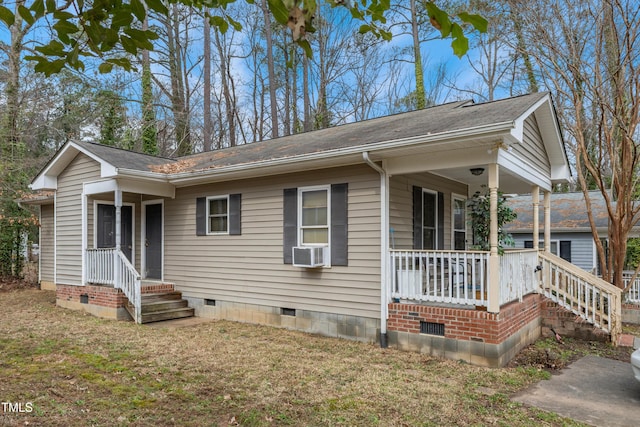 view of front of home featuring crawl space, a porch, cooling unit, and a front yard