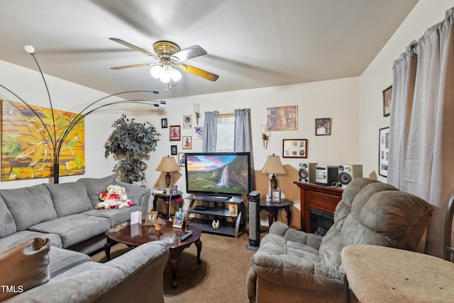 carpeted living room featuring a fireplace and ceiling fan