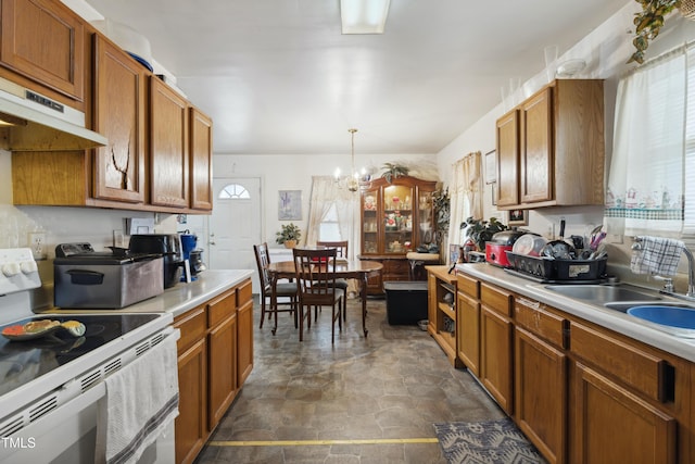 kitchen with a sink, white range with electric stovetop, and a healthy amount of sunlight