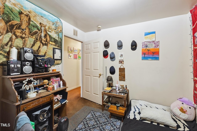 carpeted bedroom with baseboards and visible vents