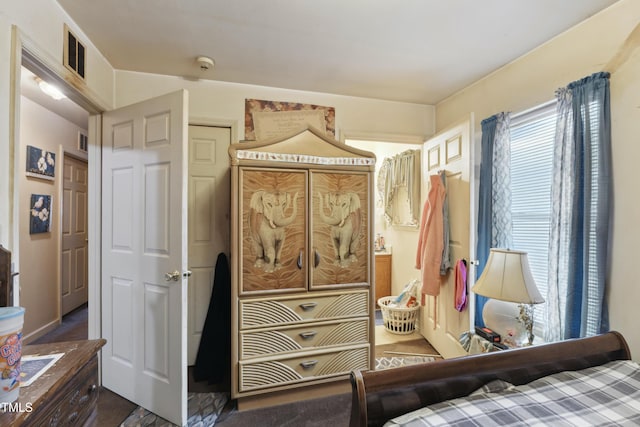 bedroom featuring visible vents