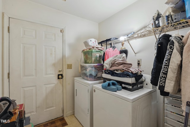 clothes washing area featuring laundry area and separate washer and dryer