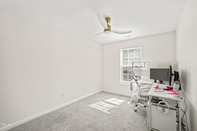 office area with baseboards, carpet floors, visible vents, and a ceiling fan