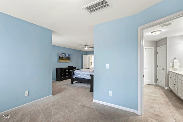 bedroom with light colored carpet, baseboards, and visible vents