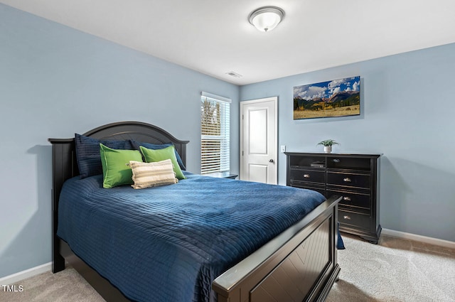 bedroom with carpet flooring, baseboards, and visible vents