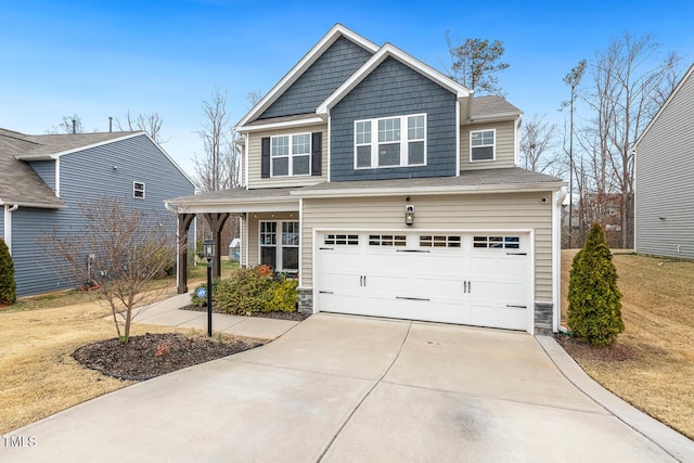 view of front of property with stone siding, driveway, and a garage