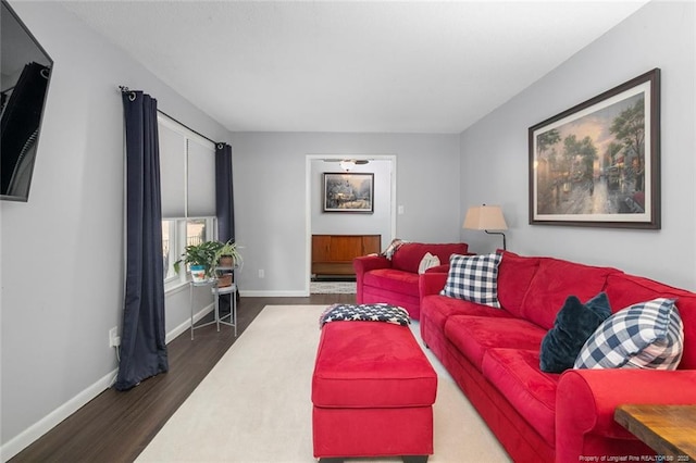 living area featuring wood finished floors and baseboards