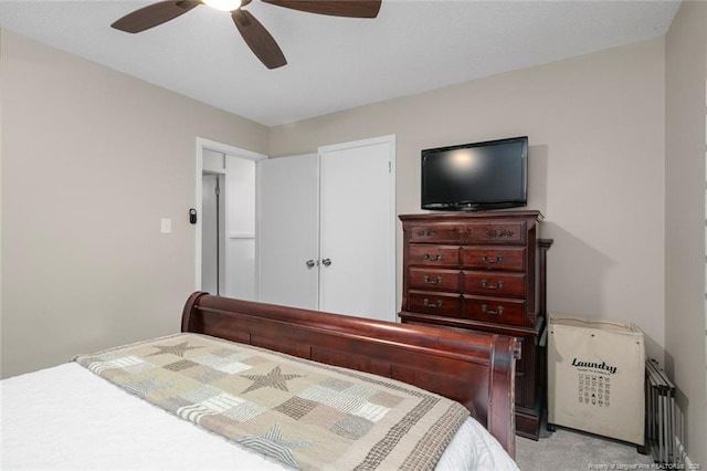 bedroom with light colored carpet and ceiling fan