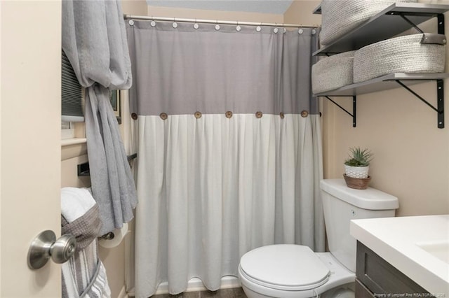 full bathroom with a shower with curtain, vanity, and toilet