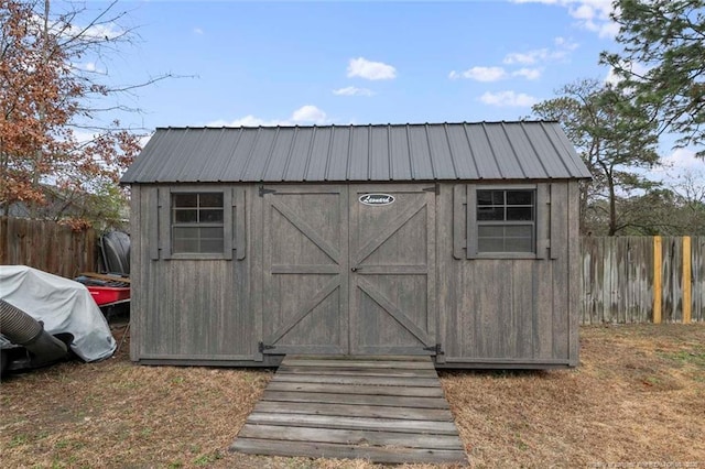 view of shed with a fenced backyard