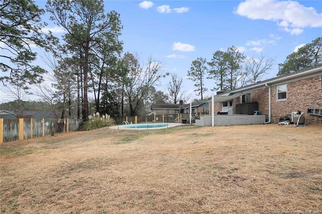 view of yard with a fenced backyard and a fenced in pool