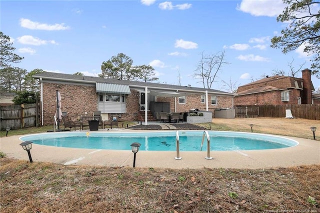 view of pool with a fenced backyard, a fenced in pool, and a patio