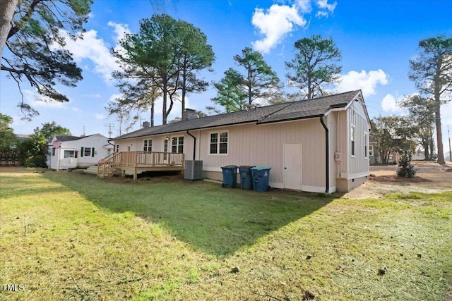 back of property featuring a yard, a chimney, central AC unit, crawl space, and a wooden deck