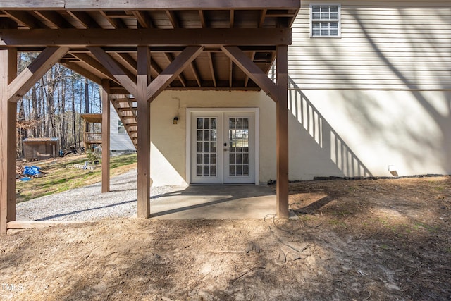 entrance to property featuring french doors and a patio area