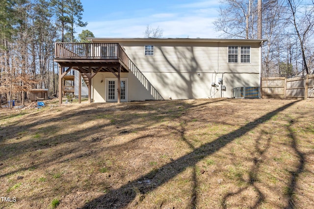 rear view of property with stairway, french doors, fence, and a deck