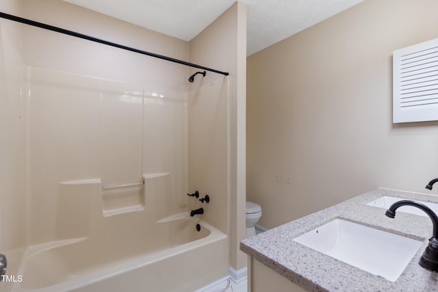 full bath featuring a textured ceiling, toilet, vanity, and bathing tub / shower combination