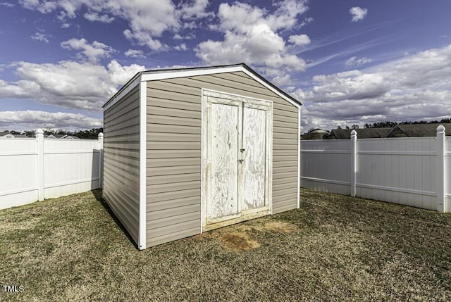 view of shed featuring a fenced backyard