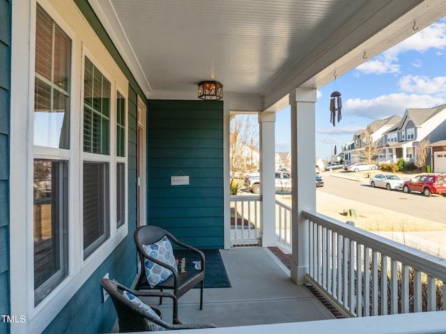 balcony with a residential view and a porch