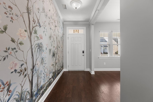 entryway with visible vents, crown molding, baseboards, and wood finished floors