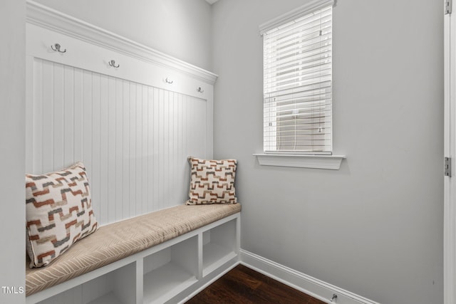 mudroom featuring baseboards and dark wood finished floors