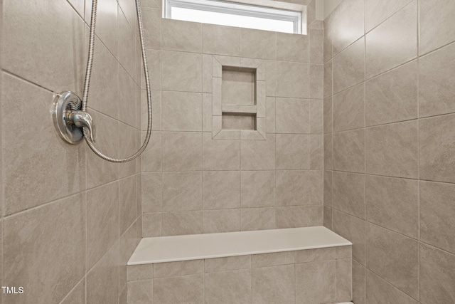 full bathroom with tiled shower