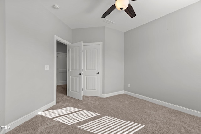 unfurnished bedroom featuring visible vents, baseboards, and carpet floors