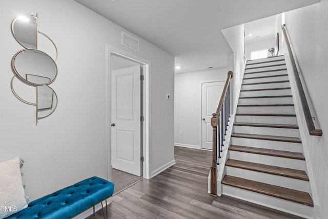 interior space with recessed lighting, visible vents, baseboards, and wood finished floors