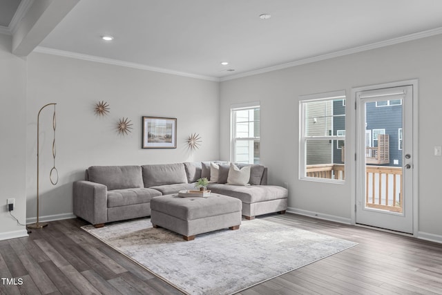 living room with ornamental molding, dark wood finished floors, and baseboards