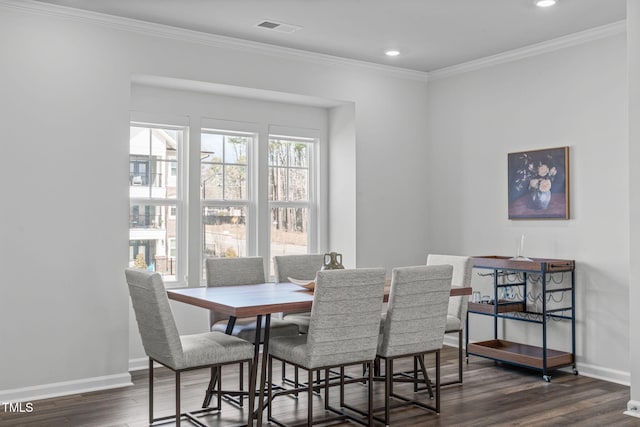 dining room with baseboards, visible vents, ornamental molding, dark wood-style flooring, and recessed lighting