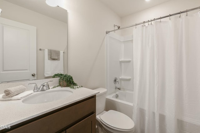 bathroom featuring shower / tub combo, vanity, and toilet