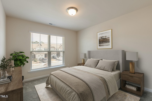 bedroom featuring visible vents, baseboards, and carpet flooring