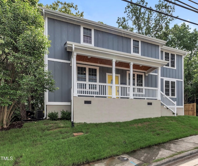 view of front of house featuring covered porch, board and batten siding, crawl space, central AC, and a front lawn