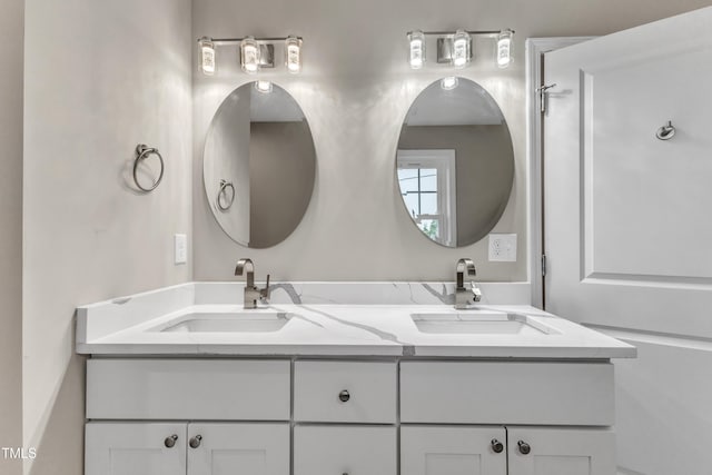 bathroom with double vanity and a sink