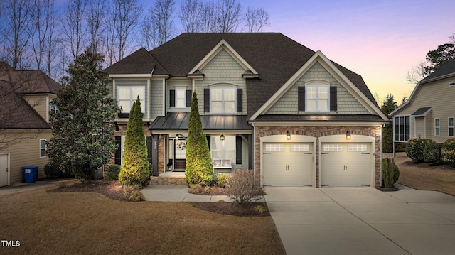 view of front facade featuring a garage, stone siding, concrete driveway, and a standing seam roof