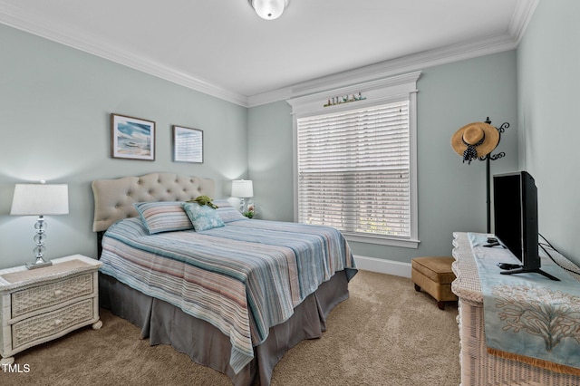 carpeted bedroom with baseboards and crown molding