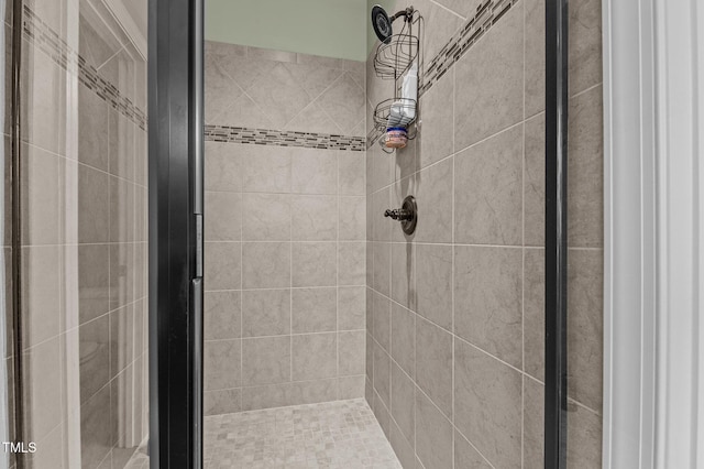 bathroom featuring a stall shower