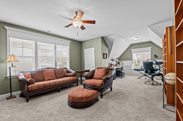 living area featuring visible vents, a ceiling fan, baseboards, carpet, and lofted ceiling