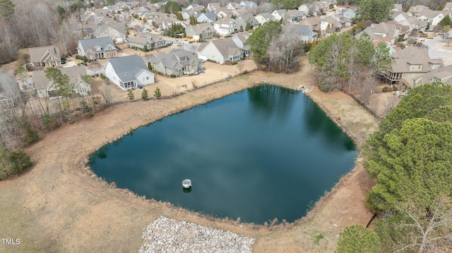 bird's eye view with a residential view and a water view